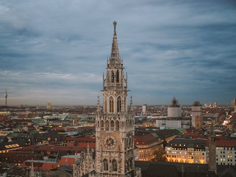 A stunning view of Munich's New Town Hall at dusk showcasing its Gothic architecture.